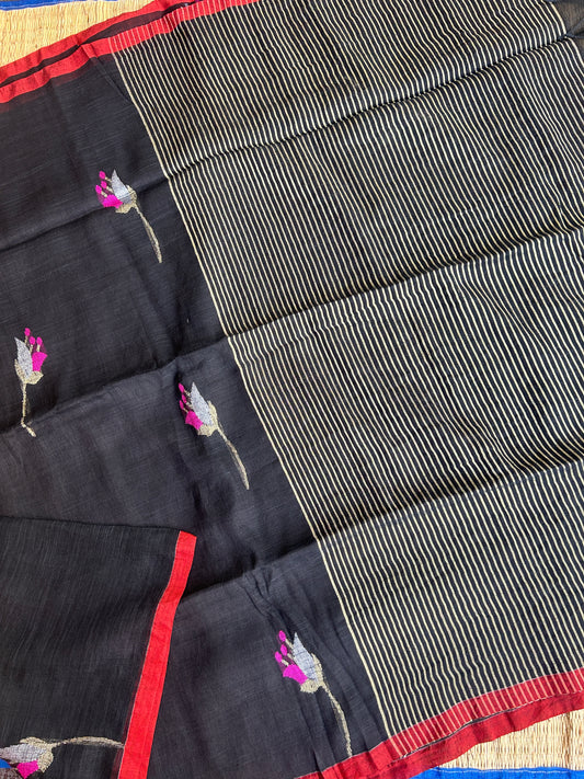 Black linen jamdani saree with floral motifs and orange border