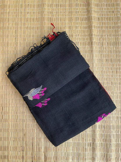 Black linen jamdani saree with floral motifs and orange border