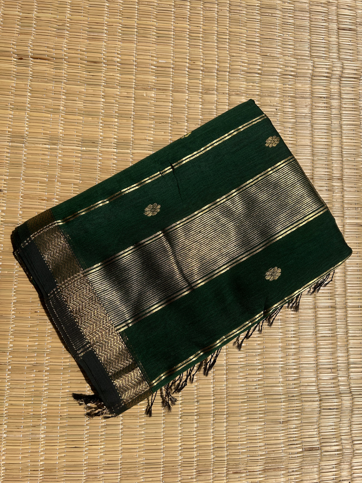 Dark Green Maheshwari handloom saree with flower motifs