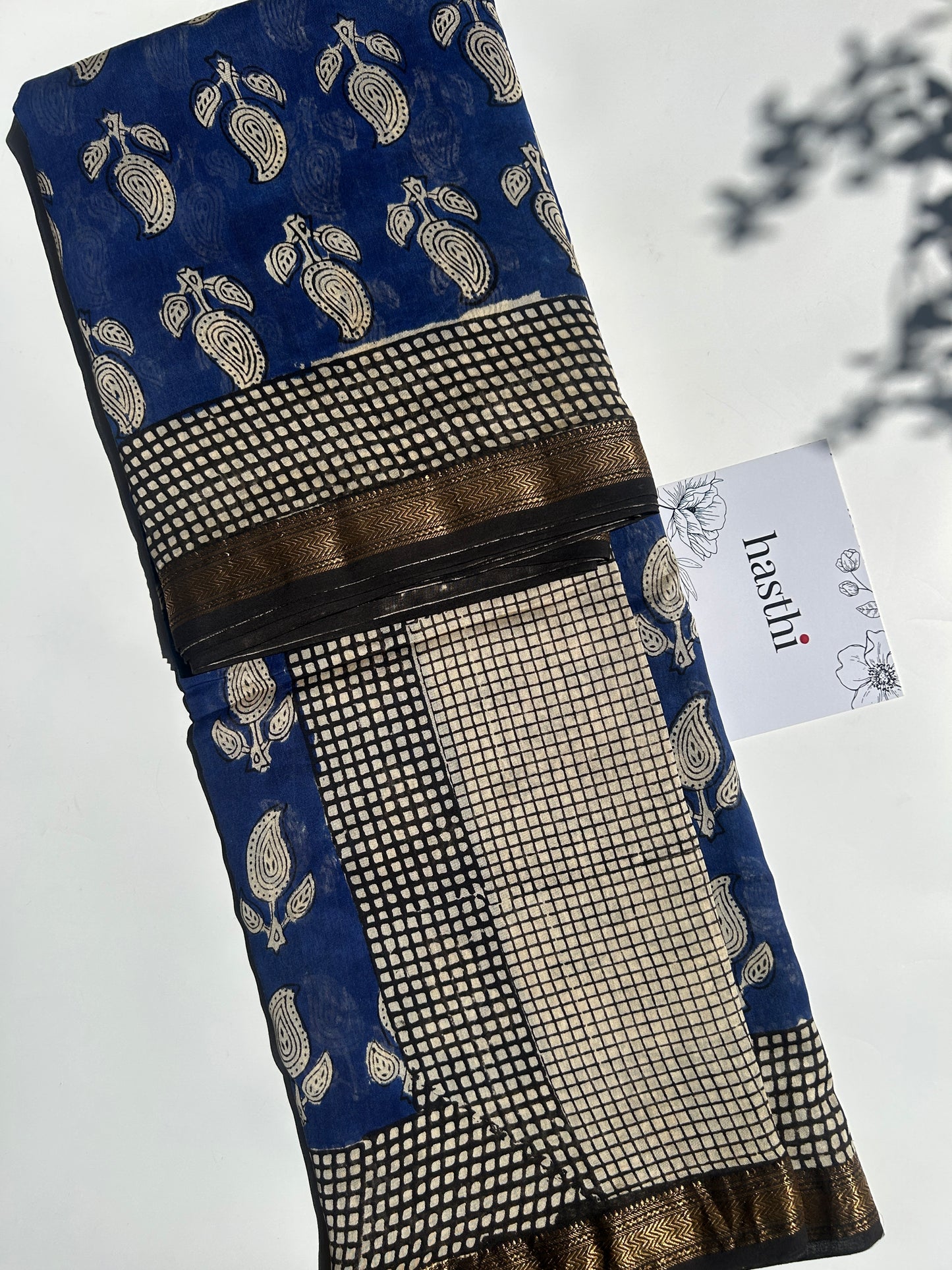 Blue Maheshwari silk saree with white motifs