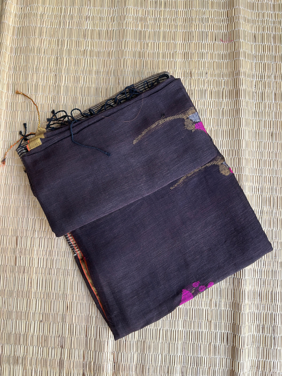 Dark chocolate Brown linen jamdani saree with floral motifs and golden border