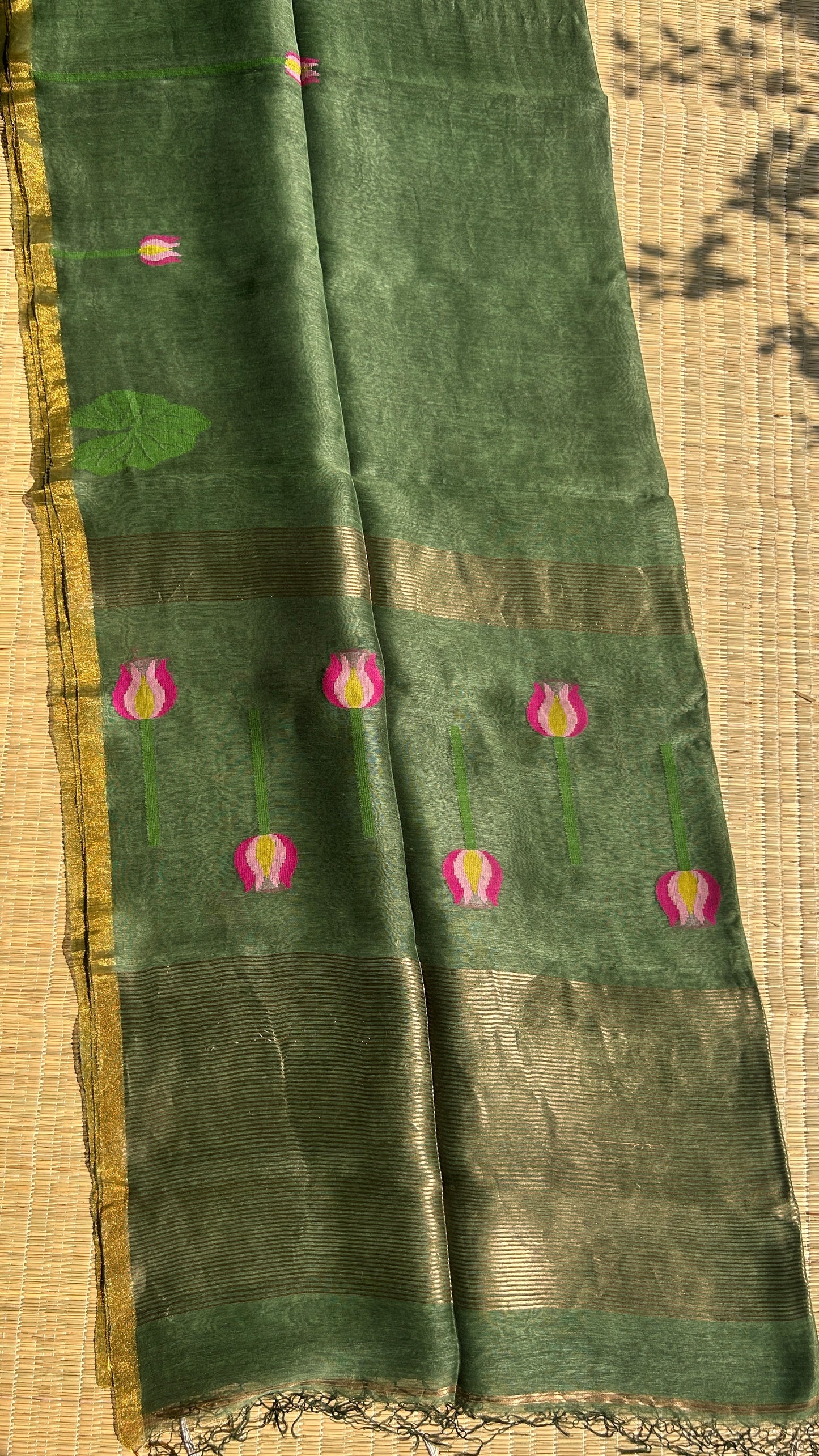 Green silk linen jamdani saree with lotus motifs