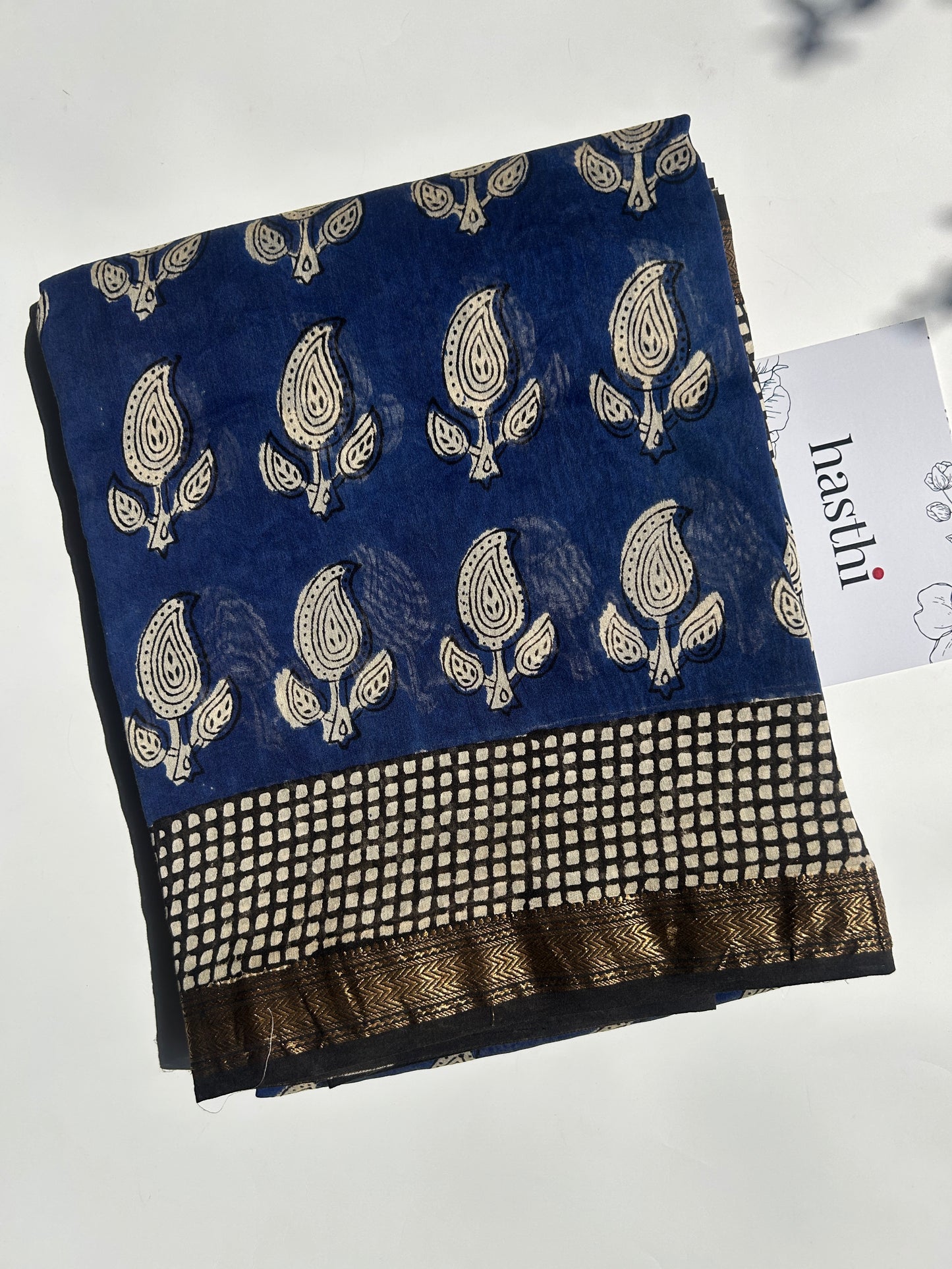 Blue Maheshwari silk saree with white motifs