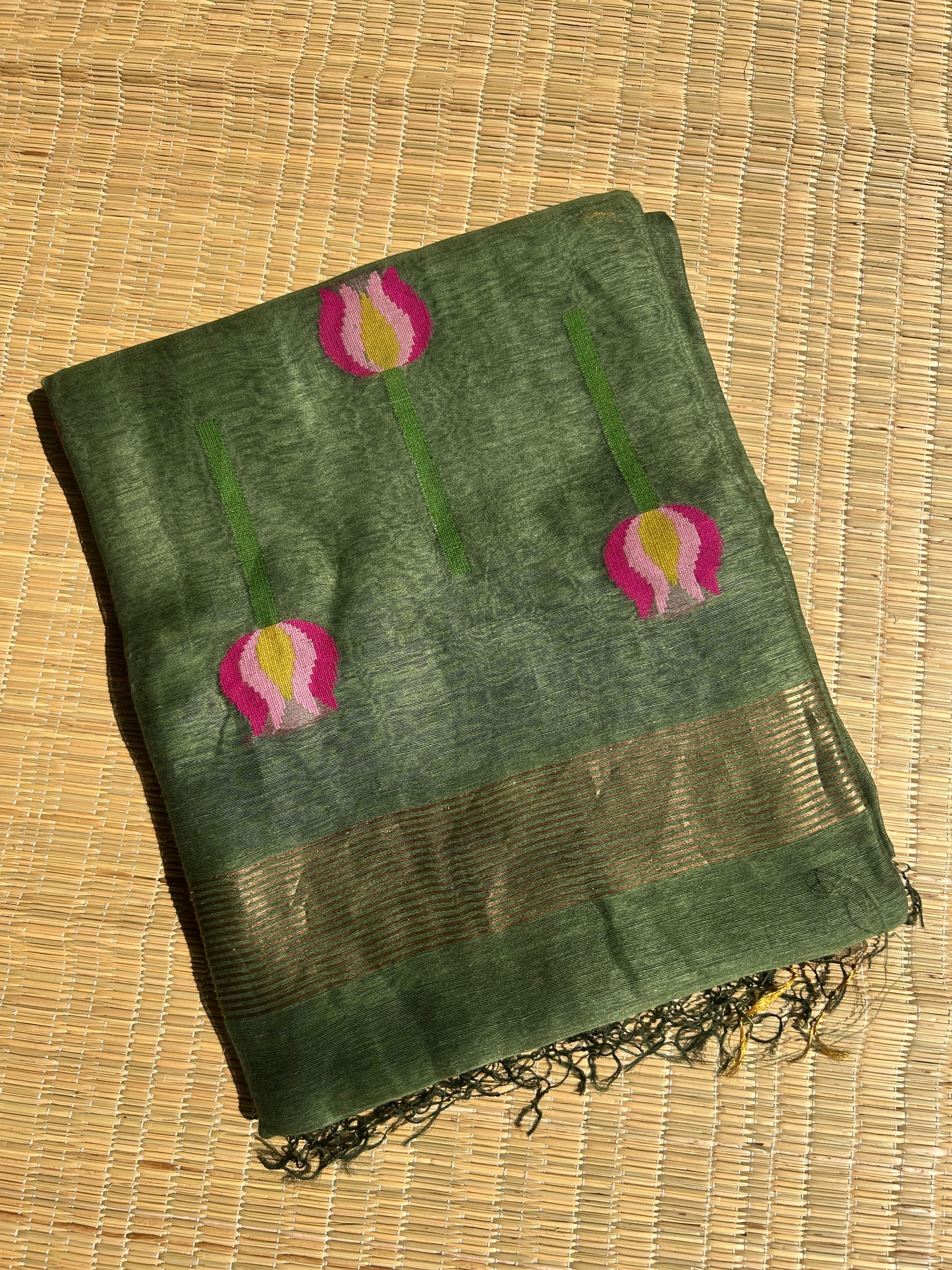 Green silk linen jamdani saree with lotus motifs