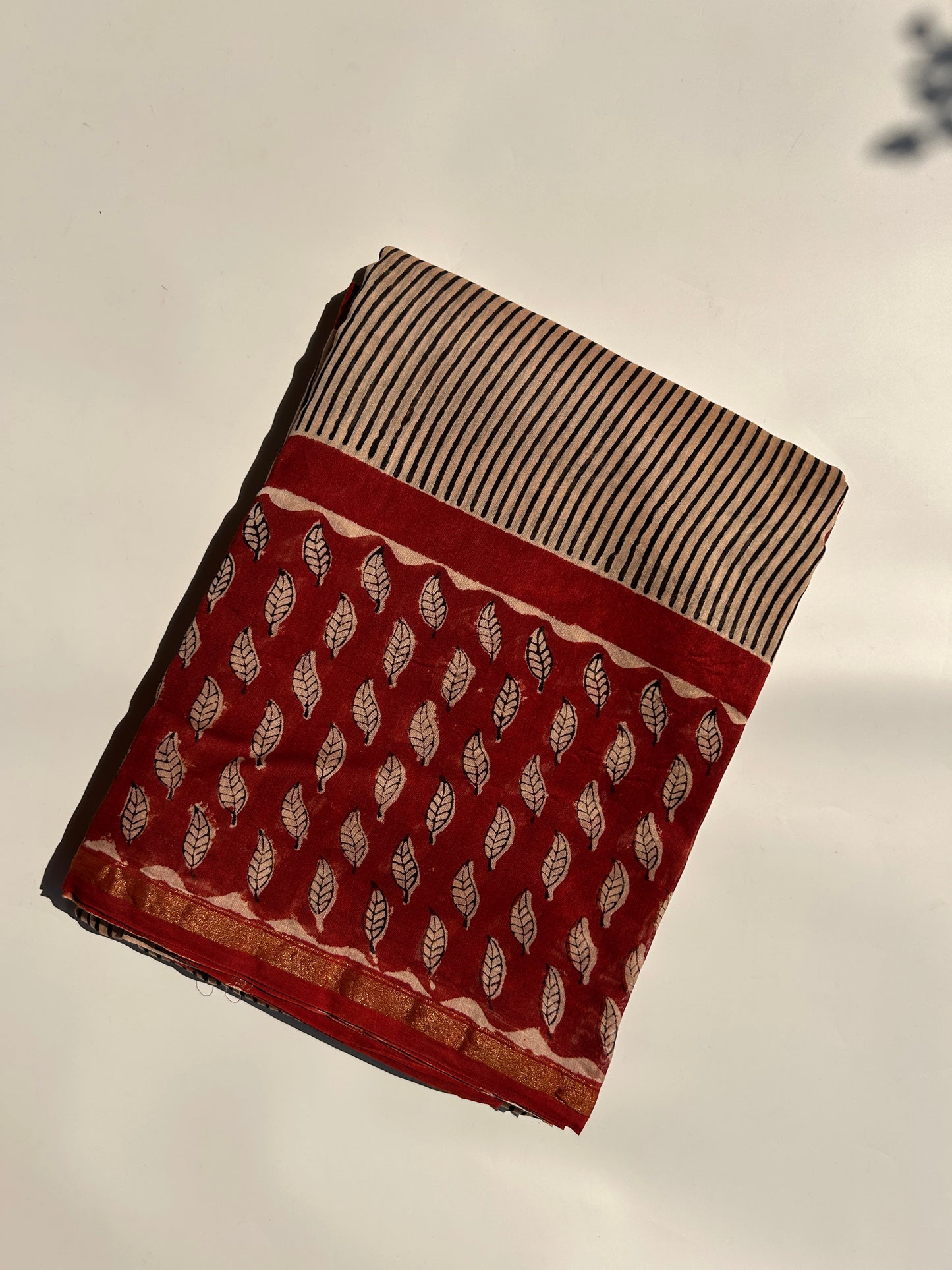 Cream Chanderi silk saree with black stripes and red border