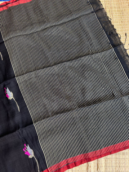 Black linen jamdani saree with floral motifs and orange border