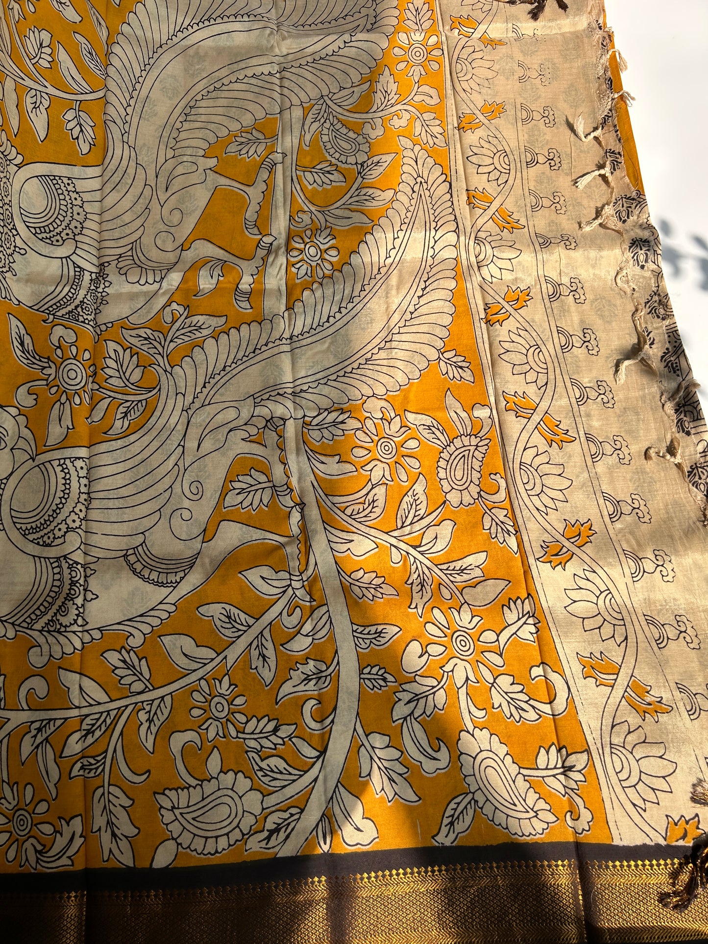 Yellow chennur silk kalamkari saree with Nizam border