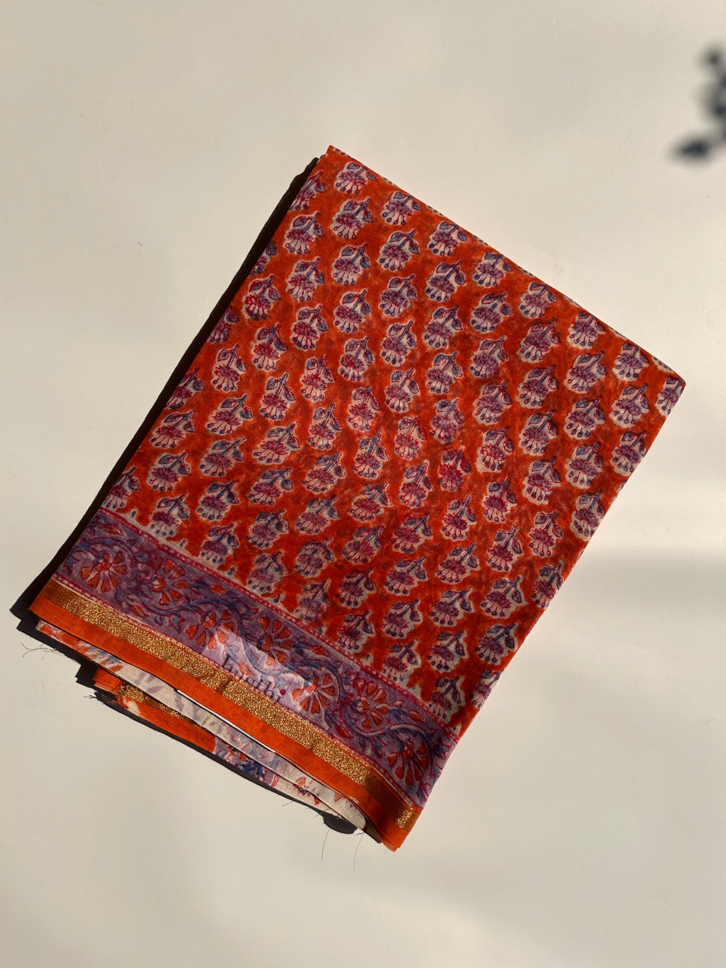 Orange Chanderi silk saree with small florals